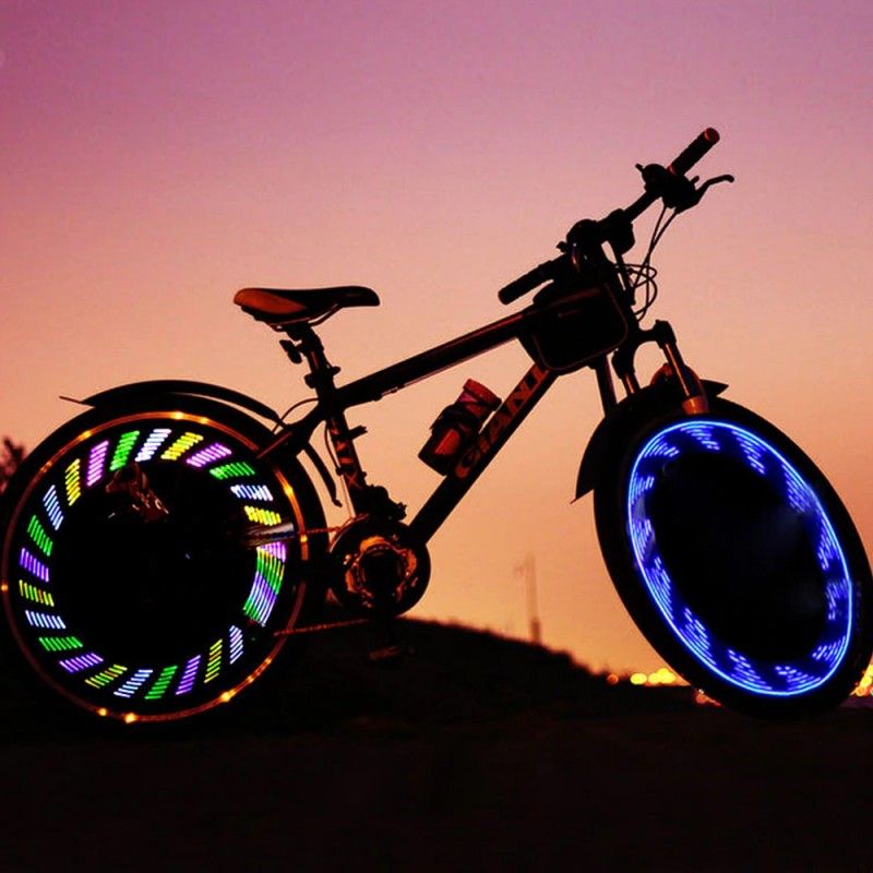 Lumini spite bicicleta, LED RGB, 12 modele luminoase, senzor miscare, baterii CR2032 Engros